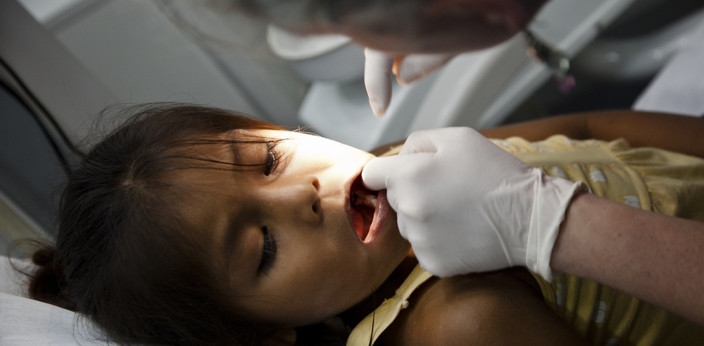 Child receiving dental treatment